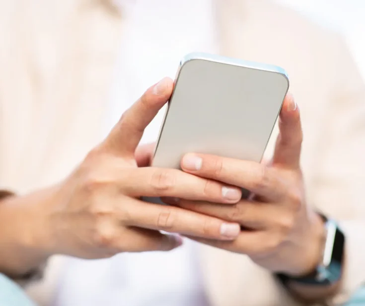 Man hands holding smartphone, unrecognizable entrepreneur in casual outfit using call phone, typing email, chatting, websurfing, cropped. Mobile application, communication